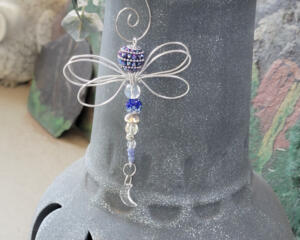 Artisan dragonfly hanging crafted from wire and beads in a nature-inspired style